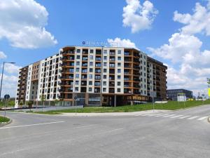 a large building on the side of a street at The Little Haven in Kragujevac