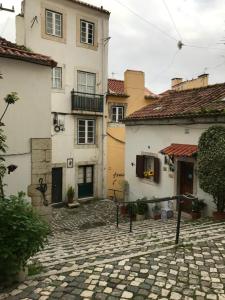 a group of buildings and a cobblestone street at coração alfama in Lisbon