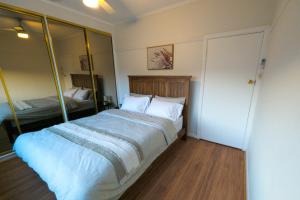 a bedroom with a large bed with white pillows at Home in Moe in Moe