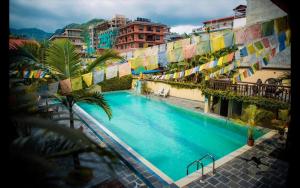 an overhead view of a swimming pool in a building at RJ Hotel Pokhara in Pokhara
