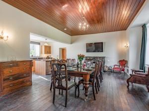 a kitchen and dining room with a table and chairs at Groudd Hall in Cerrigydrudion