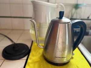 a tea kettle sitting on top of a counter at Citrus Loft - Quiet and convenient female only in Covina