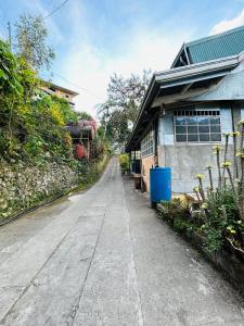 an empty street in front of a house at Mama Lourdes Homestay in Sagada +6 photos