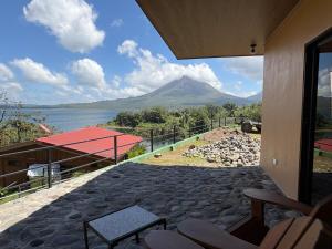 a view of a mountain from the porch of a house at Cabin Casove in El Castillo de La Fortuna