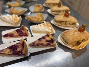 a bunch of plates of food on a table at Hostal Suomi in Los Ángeles