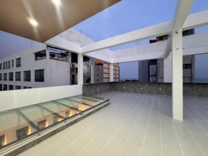 a balcony of a building with a glass floor at Phao Hotel in Vung Tau