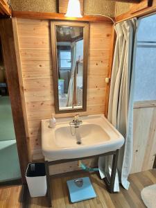 a bathroom with a sink and a mirror at イトノ-itono- in Goto +27 photos