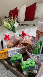 a tray filled with food on top of a bed at Antonia in San Nicolás de los Arroyos +3 photos
