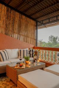 a living room with a couch and a table at Casa Superfly 2BHK with Rooftop Jacuzzi & Terrace Deck Excellent Location Boilermaker Thalassa in Oxel