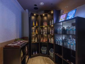 a bar with a lot of bottles of alcohol at Hotel Metro (Adult Only) in Yokohama +134 photos