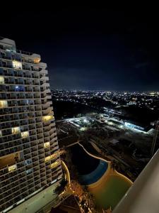 a view of a large building at night at Mekeni Azure Escape in San Fernando