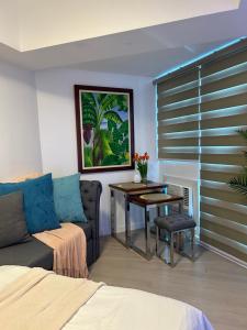 a living room with a couch and a table with a table at Mekeni Azure Escape in San Fernando