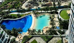 an overhead view of a swimming pool at a resort at Mekeni Azure Escape in San Fernando +3 photos