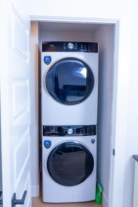 a washer and dryer in a room at Honeycomb Suite in Riverview