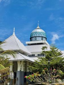 a building with a dome on top of it at Summer village in Kampong Pasir Hantu +6 photos