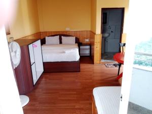 a small room with a bed and a bathroom at ViDi Hotel Serene Point ! Kalimpong in Kalimpong