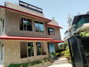 a building with the front of the hotel triumph room at ViDi Hotel Serene Point ! Kalimpong in Kalimpong