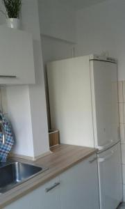 Kuchyňa alebo kuchynka v ubytovaní Center Warsaw - Apartament Jana Pawła