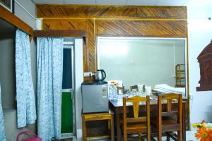 a dining room with a table and chairs at Banalata Resort in Jaypur