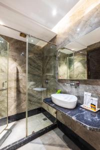 a bathroom with a sink and a shower at The Vanson Delite "Newly Rebuilt 2026" - Near New Delhi Station & Connaught Place in New Delhi +67 photos