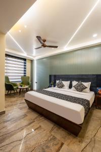a bedroom with a large bed in a room at The Vanson Delite "Newly Rebuilt 2026" - Near New Delhi Station & Connaught Place in New Delhi