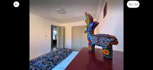 a statue of a donkey on a table in a room at Cómoda y céntrica habitación en Tenochtitlán, en departamento compartido, CDMX in Mexico City