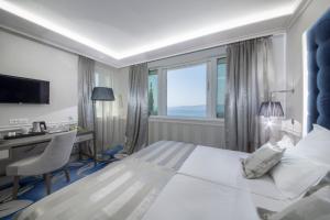 Posteľ alebo postele v izbe v ubytovaní Grand Hotel Slavia - Adults only + 37 fotografií