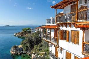 a view of the ocean from the side of a building at Hotel Villa Orsa in Skiathos Town