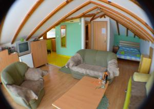 a living room with two couches and a table at Villa Ohrid in Ohrid