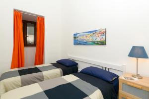 Posteľ alebo postele v izbe v ubytovaní Residenza Santa Chiara