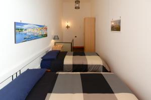 Posteľ alebo postele v izbe v ubytovaní Residenza Santa Chiara
