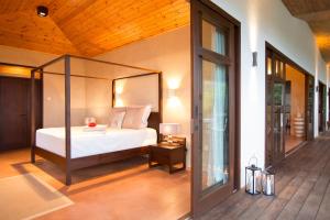 Postel nebo postele na pokoji v ubytování Villas Palm Royal + 30 fotografií