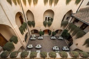 an overhead view of a courtyard with chairs and plants at San Biagio Relais in Orbetello