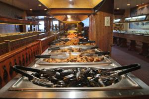 a buffet line of food on trays in a restaurant at Plim Plaza Hotel in Ocean City