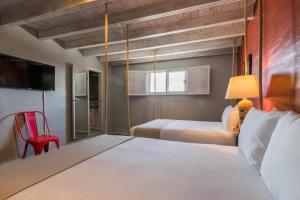Cama o camas de una habitación en Hotel Damiana Boutique