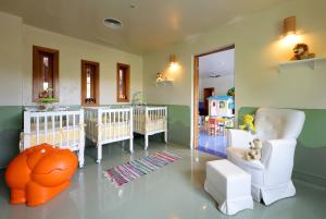 a nursery with two cribs and a room with two babies at Grand Palladium Imbassaí Resort & Spa - All Inclusive in Imbassai