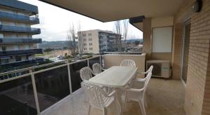 a balcony with a table and chairs on a balcony at Apartamentos Inbesal in La Pineda