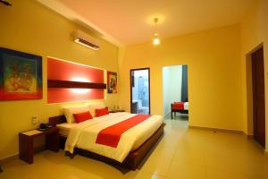 a bedroom with a large bed in a room at Sea Breeze Deluxe Inn in Negombo