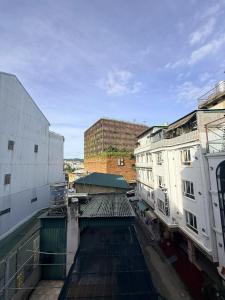 a view from the top of a building with buildings at Nghia Lan Hotel - Dalat Market in Da Lat