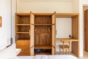 a room with a bed and a desk in a room at Yemaya Villas in Kuta Lombok +37 photos