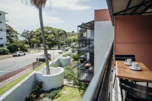 an apartment balcony with a view of a street at Hotel Nelson in Nelson Bay