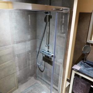 a shower with a glass door in a bathroom at Poles Apart in Ax-les-Thermes +15 photos