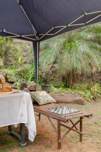 a picnic table with a chessboard on top at Casa Superfly 2BHK with Rooftop Jacuzzi & Terrace Deck Excellent Location Boilermaker Thalassa in Oxel