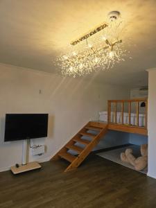 a room with a bunk bed and a flat screen tv at 경기도 양평군 강남로714-14 미니조식무료서비스 in Yangpyeong