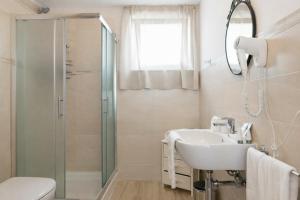 a bathroom with a sink and a shower at Podere n°8 Agriturismo in Maremma in Alberese +75 photos