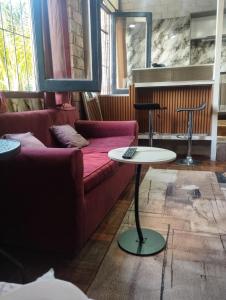 a living room with a couch and a table at Sarandí Lofts in Montevideo