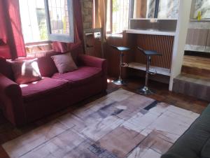 a living room with a couch and a table at Sarandí Lofts in Montevideo