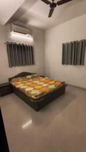 a bedroom with a bed in a room at Mist Villa in Igatpuri