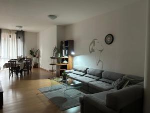 a living room with a couch and a table at Lake Garda in Gavardo