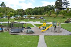a park with a playground with a slide at Waitomo TOP 10 Holiday Park in Waitomo Caves